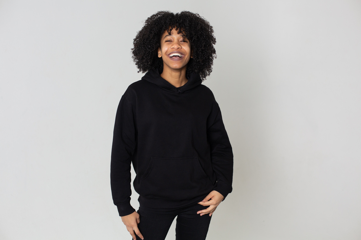 Positive black woman in hoodie